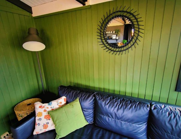 green-farm-stay-cabin-sofa-comfy