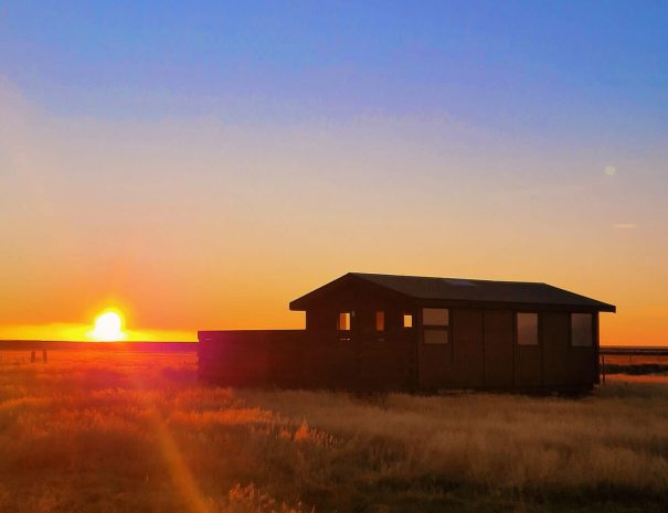 green-farm-stay-cabin-sunset-views
