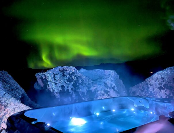 Jacuzzi under the Aurora south coast Iceland Sky Retreat