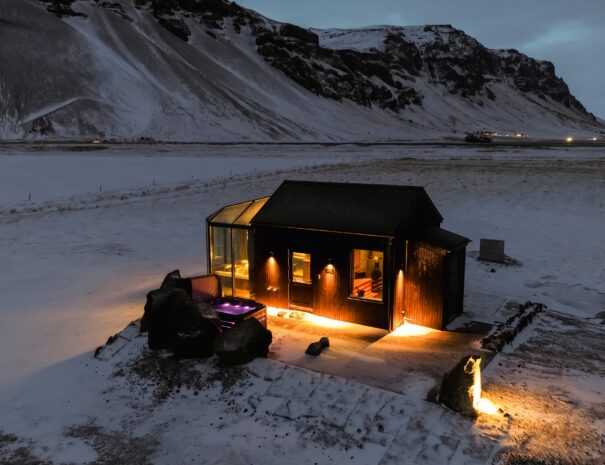 Night-time view at wellness retreat at Sky retreat Iceland next to Skógafoss
