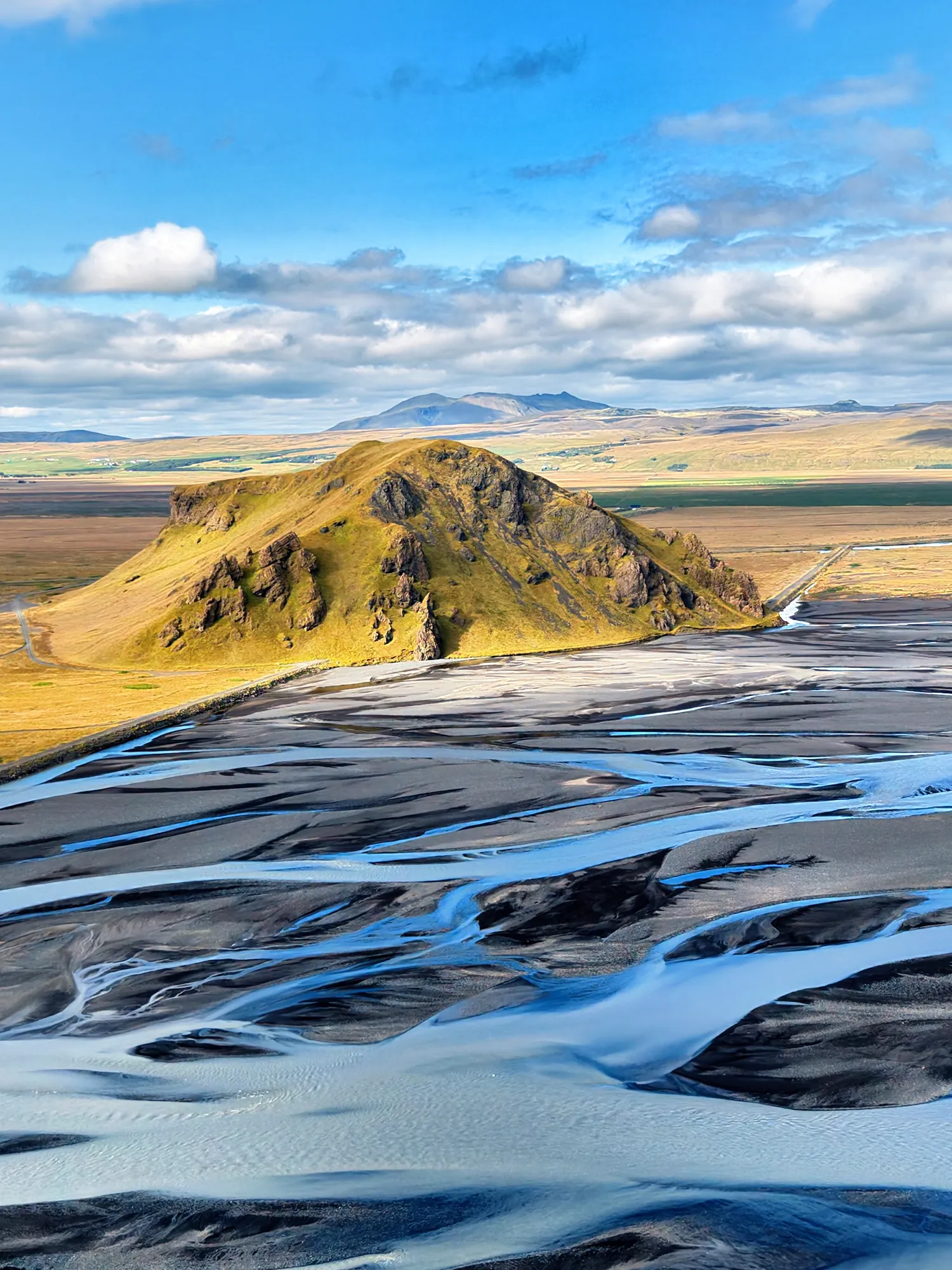 Braided glacial channels of Markarfljót river around Stóri-Dímon in summer, aerial view