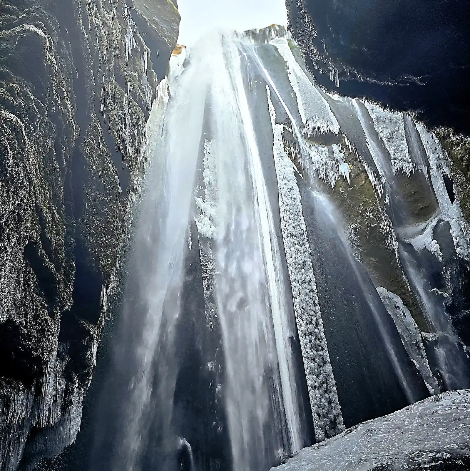 Gljufrabui hidden waterfall in winter with ice formations Iceland