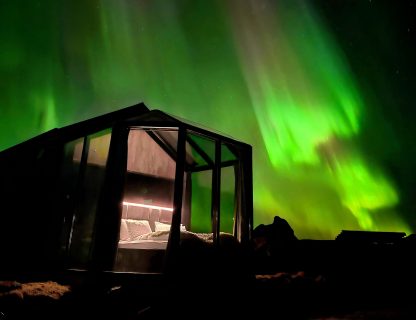 Aurora glass cabin at Sky Retreat Iceland Aurora dances above 360 degree glass bedroom